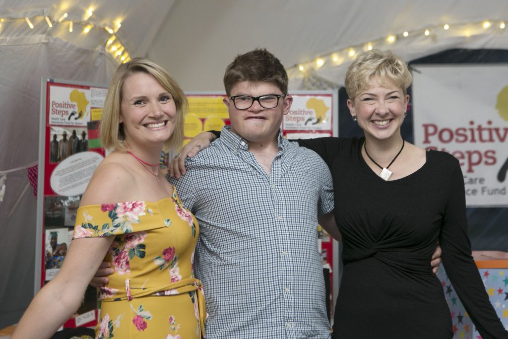 Two adults and an EMA Moreton student at the Fundraising Success at the Nkhoma Hospital Solar Project Launch.