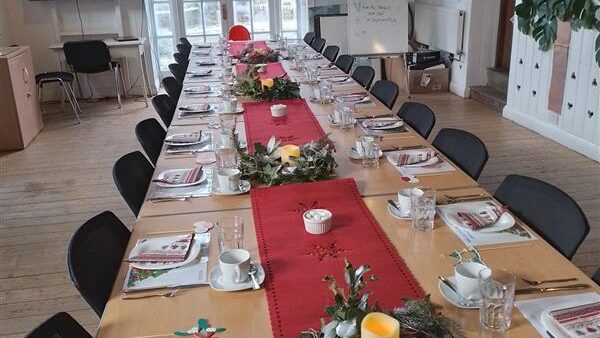 The tables for the Xmas afternoon tea fully laid.