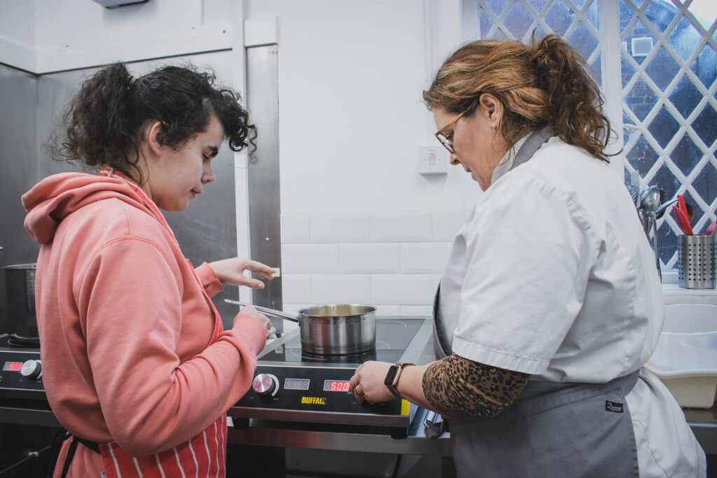 Hospitality Tutor Claire Alexander Brown in February 2024 teaching a student for her Tutor Spotlight video