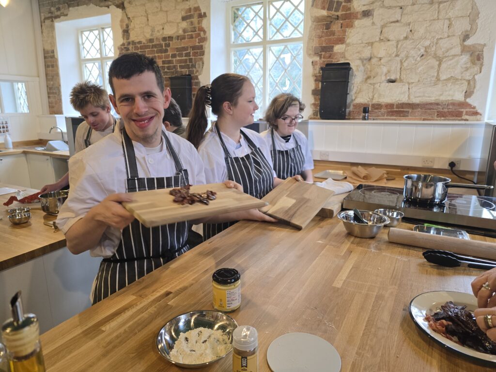 4 ema students in the stage of preparing dinners in the moreton tearooms