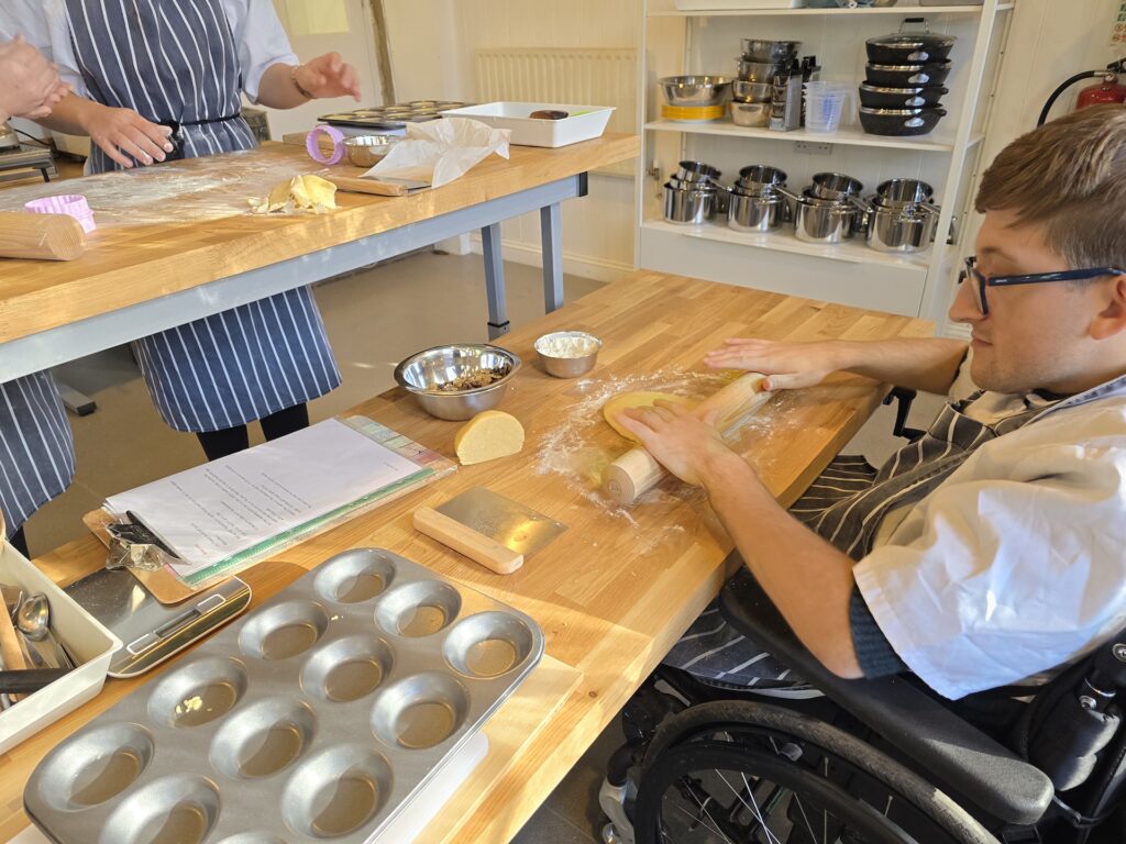 ema student using a rolling pin while baking mince pies