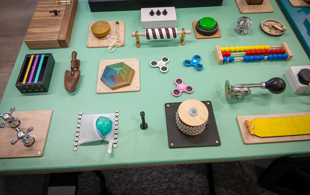 a fidget board with a diverse range of interactive sensory tools